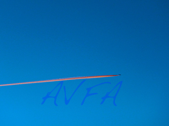 Blue sky Pink contrail